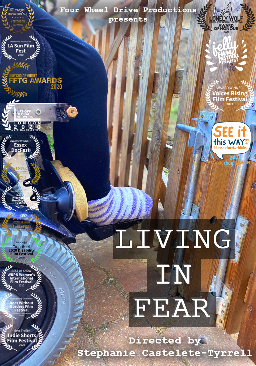 Living In Fear poster - you can see a wheelchair facing towards a gate